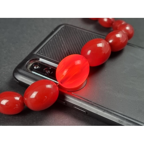 1110 - A Bakelite 'cherry amber' graduated bead necklace, 79cm long, 72g.