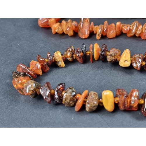 1112 - Two amber necklaces, 62cm and 70cm long, gross weight 189g.