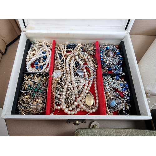 1133 - A quantity of costume jewellery and watches.