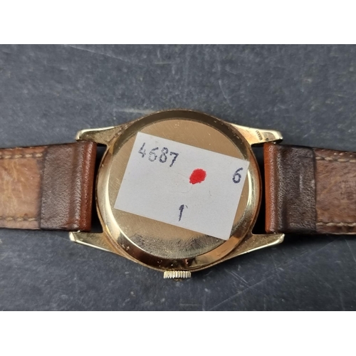 1144 - A 1950s Omega 9ct gold manual wind wristwatch, 33mm, on replacement leather strap, Cal 267. Serial N... 