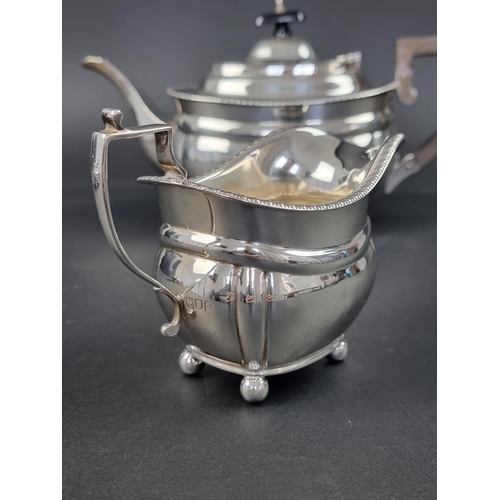 604 - A silver three piece tea set, by C S Harris & Sons Ltd, London 1914, gross weight 901g.... 