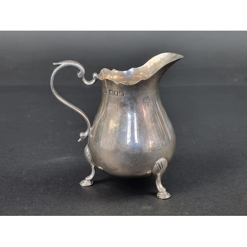 615 - A Victorian silver milk jug, by Edwin Charles Purdie, London 1897, 9.5cm high, 131g.... 