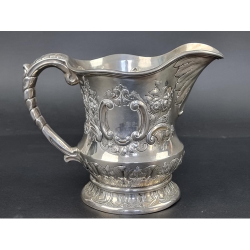 627 - An Edwardian silver repousse jug, by George Nathan & Ridley Hayes, Chester 1904, 15.5cm high, 43... 