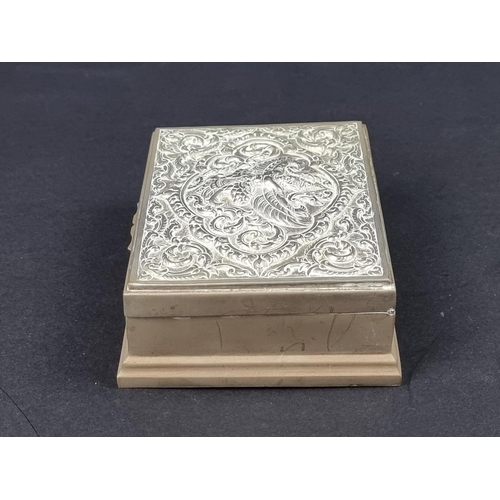 628 - A Thai white metal cigarette box, 12cm wide.