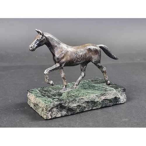 661 - A silver horse, by A E S, Birmingham 1973, on marble base, the base 17cm wide.