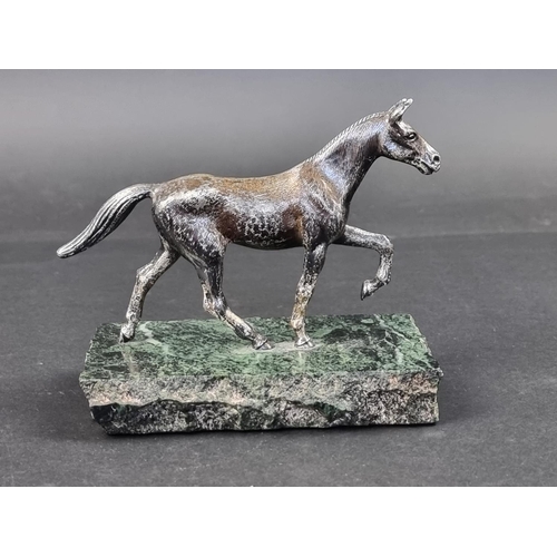 661 - A silver horse, by A E S, Birmingham 1973, on marble base, the base 17cm wide.