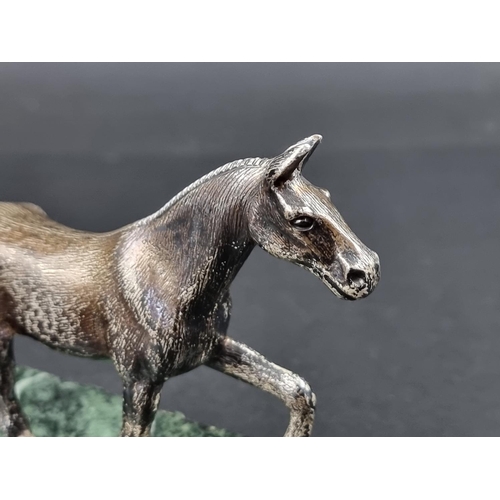 661 - A silver horse, by A E S, Birmingham 1973, on marble base, the base 17cm wide.