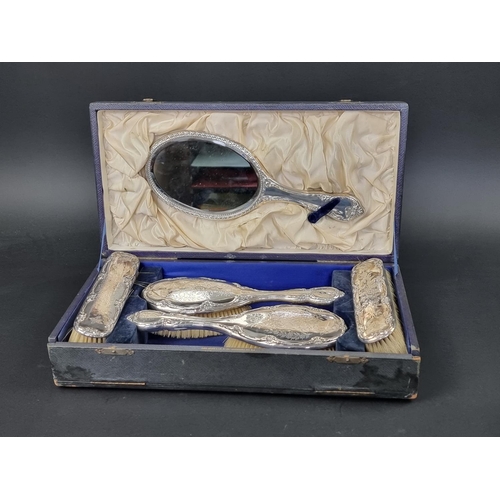 677 - A cased silver five piece dressing table set, by W J Myatt & Co, Birmingham 1942.... 