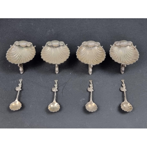 680 - A cased set of four Victorian EPNS shell salts and spoons.