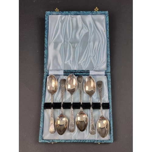 683 - A cased set of six Edwardian 'hammered' silver teaspoons, by W S Savage & Co, Sheffield 1906, 86... 