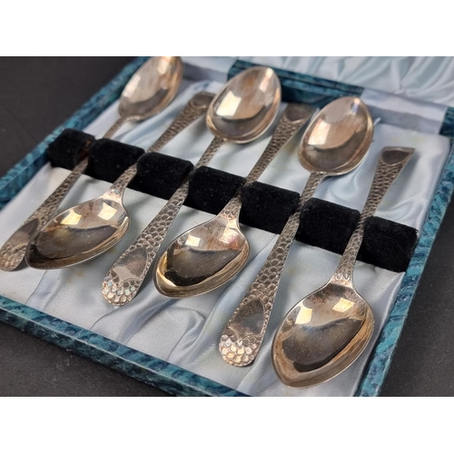 683 - A cased set of six Edwardian 'hammered' silver teaspoons, by W S Savage & Co, Sheffield 1906, 86... 