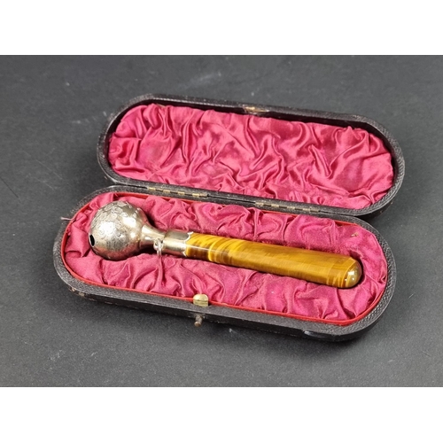 686 - A cased Victorian silver child's rattle, having tiger's eye handle, by George Unite, Birmingham 1888... 