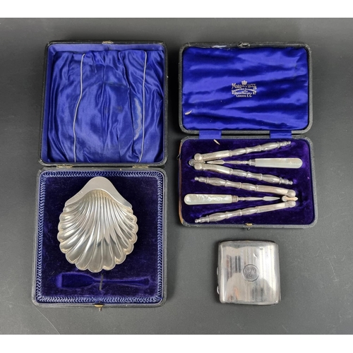 694 - A cased silver shell butter dish; together with a silver cigarette case, 150g; and a cased pair of p... 