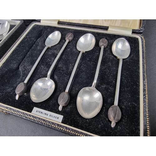 695 - A cased set of six silver rat tail coffee spoons, by C Robathan & Son, Birmingham 1979; together... 