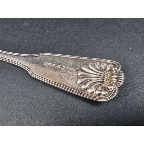 699 - A Victorian silver fiddle, thread and shell pattern basting spoon, by Elizabeth Eaton, London 1854, ... 