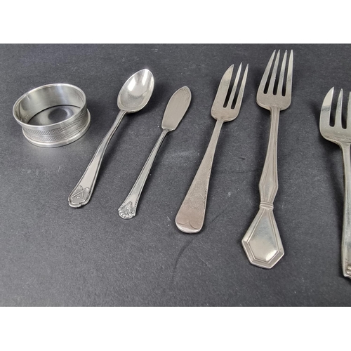 712 - A small group of silver cutlery; together with a silver napkin ring, 144g. (10)