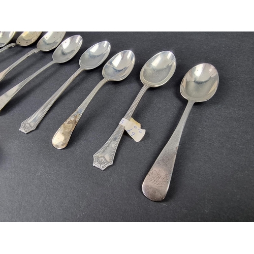 715 - Two Irish silver fiddle pattern teaspoons; together with nine other teaspoons; and a pair of sugar t... 