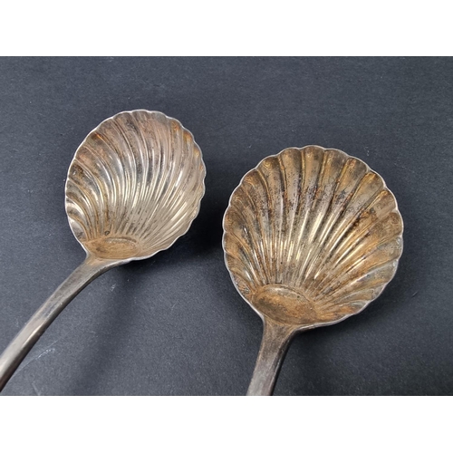 719 - A pair of George III silver Old English pattern sauce ladles, having shell bowls, by William Eley I ... 