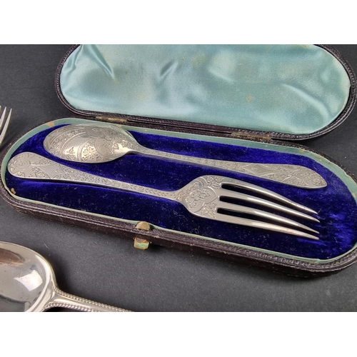 757 - A cased Victorian silver Christening fork and spoon, by Wakely & Wheeler, London 1893/4; togethe... 