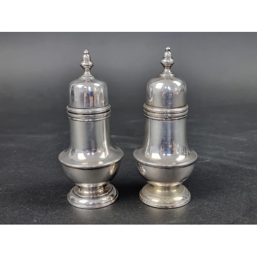 772 - A pair of George I silver 'blind' mustard casters, by Samuel Wood, London 1725, with associated cove... 