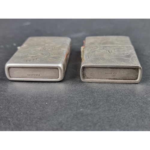 780 - A vintage Japanese white metal Zippo lighter, stamped '950 Sterling', 5.7cm high; together with anot... 