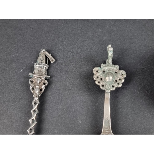 781 - A silver and mother-of-pearl trowel bookmark; together with two Continental metal spoons; and three ... 