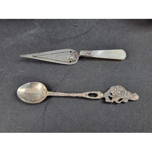 781 - A silver and mother-of-pearl trowel bookmark; together with two Continental metal spoons; and three ... 