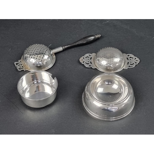 790 - A silver tea strainer and stand, by Elkington & Co Ltd, Birmingham 1965; together with another s... 