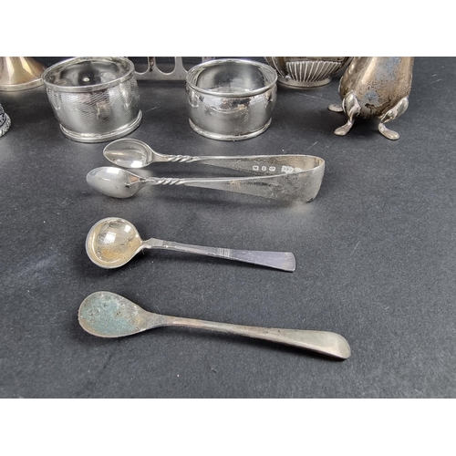 796 - A group of silver items, to include a four division silver toast rack, 398g. (15)