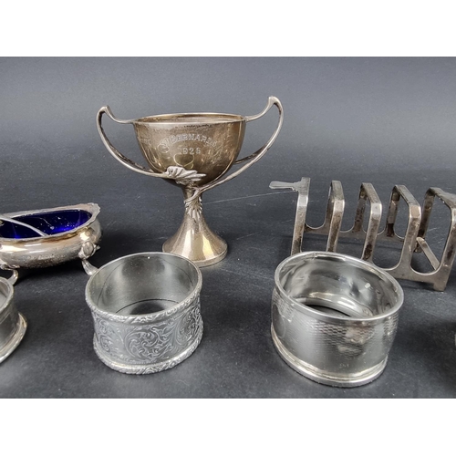 796 - A group of silver items, to include a four division silver toast rack, 398g. (15)