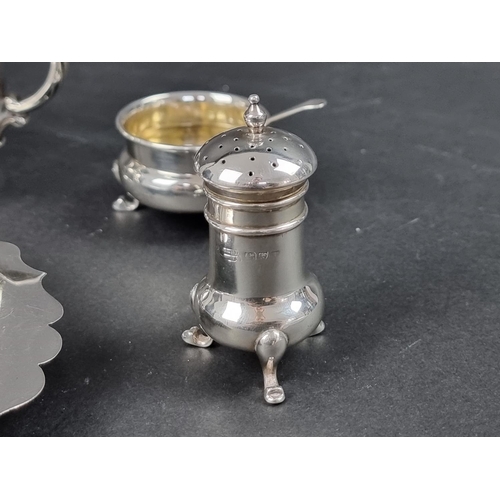 797 - A silver three piece cruet set, by James Deakin & Sons, date marks rubbed, (the two spoons by a ... 