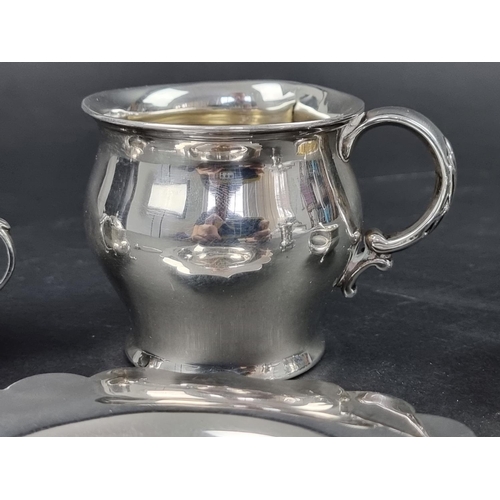 797 - A silver three piece cruet set, by James Deakin & Sons, date marks rubbed, (the two spoons by a ... 