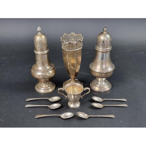 798 - A silver sugar caster, marks rubbed, 8.5cm high; together with a silver vase; a miniature trophy cup... 