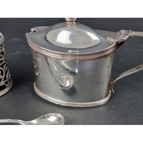 814 - A silver mustard pot, by Reid & Sons, London 1911, having blue glass liner and associated silver... 