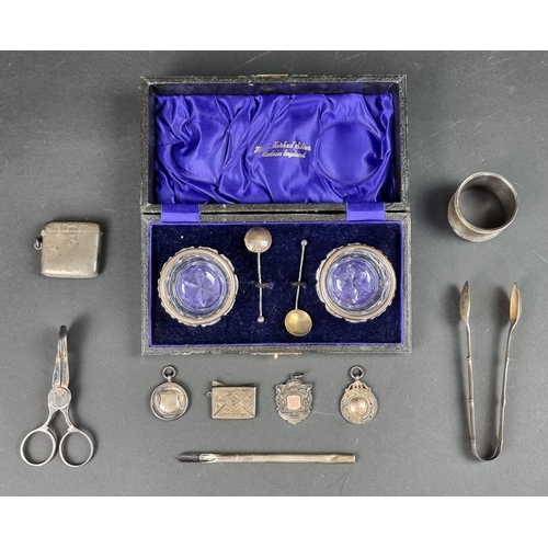 819 - A cased set of two silver mounted cut glass salts; together with a quantity of silver and white meta... 