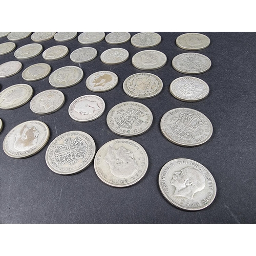 869 - A quantity of George V and George VI silver coinage, mostly .500, approximately 1720g.... 