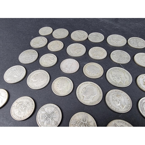 869 - A quantity of George V and George VI silver coinage, mostly .500, approximately 1720g.... 