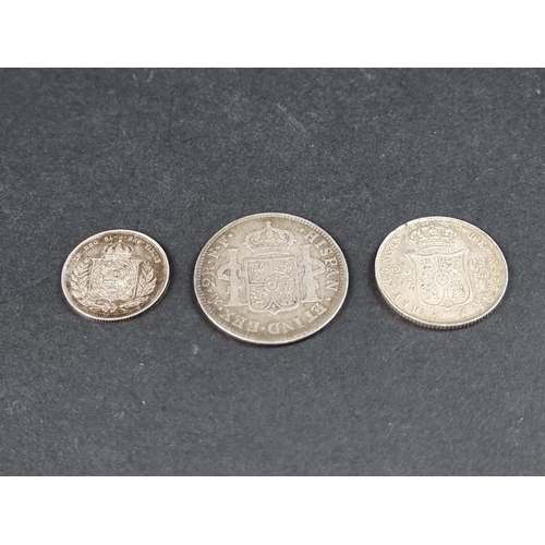 871 - Coins: a Spanish Carolus III 1782 silver two real coin; together with a Brazilian Pedro II 1860 silv... 