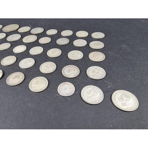 872 - Coins: a quantity of UK silver and part silver coinage, mostly George V.