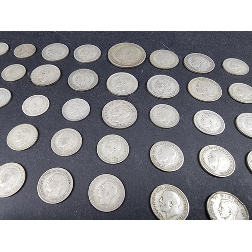 872 - Coins: a quantity of UK silver and part silver coinage, mostly George V.