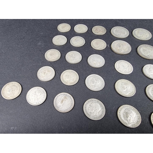 872 - Coins: a quantity of UK silver and part silver coinage, mostly George V.