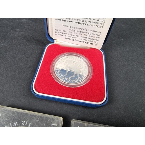 873 - Coins: a cased Elizabeth II 1977 Silver Jubilee silver crown; together with a 1935 rocking horse cro... 