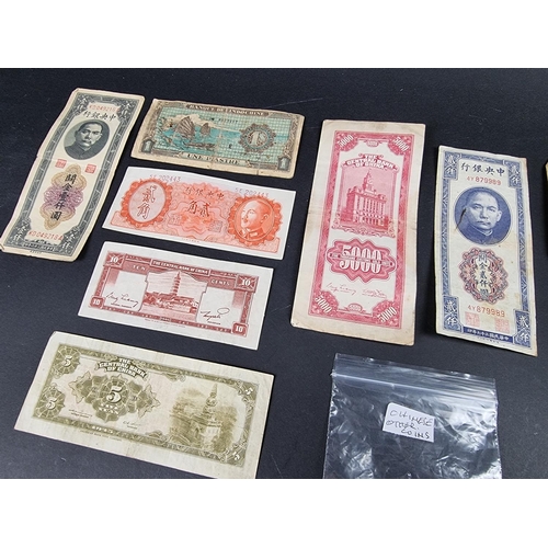 880 - Banknotes; seven Central Bank of China banknotes; together with three other Asian banknotes; and nin... 