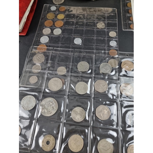 900 - Coins: a large quantity of UK and world coins, in two albums and loose.