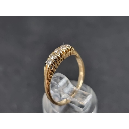 913 - A yellow metal diamond three stone ring, size O; together with a diamond five stone ring stamped 18c... 