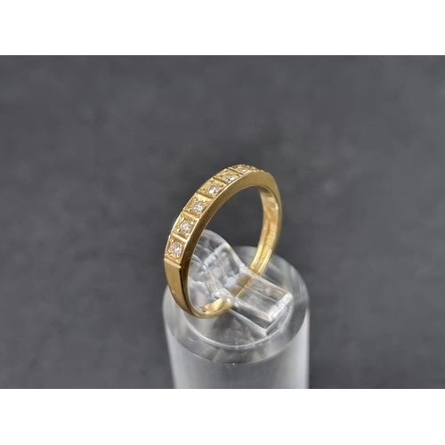 917 - An 18ct gold half eternity ring, set seven small brilliant cut diamonds, size O, gross weight 2.3g.... 