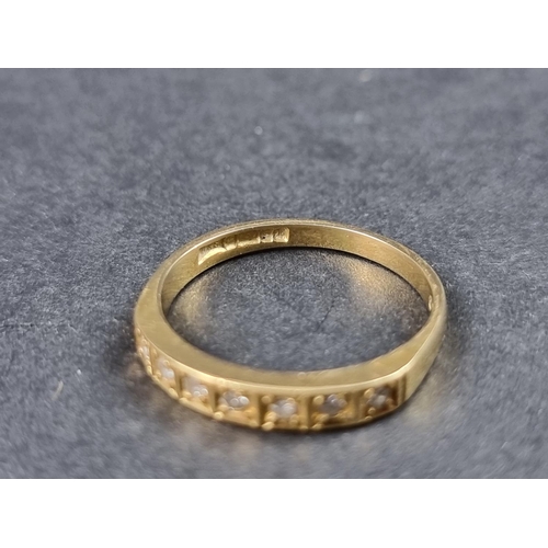 917 - An 18ct gold half eternity ring, set seven small brilliant cut diamonds, size O, gross weight 2.3g.... 