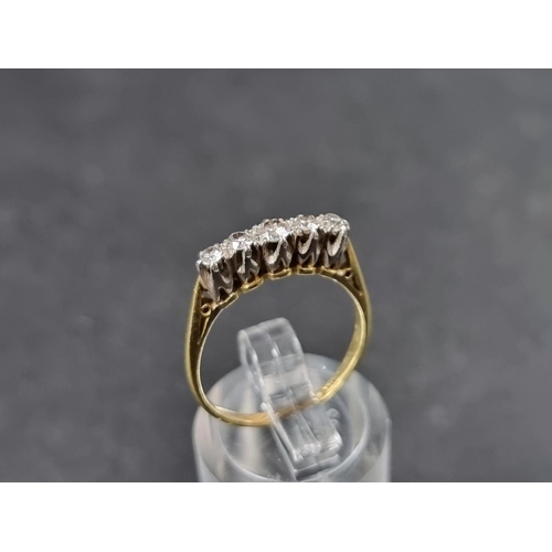 918 - A yellow metal diamond five stone ring, stamped 'Plat & 18ct', size M 1/2.