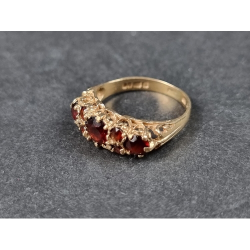 924 - A 9ct gold garnet cluster ring, size N 1/2; together with another 9ct gold garnet ring, size J 1/2, ... 