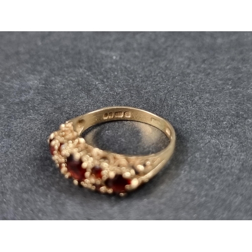 924 - A 9ct gold garnet cluster ring, size N 1/2; together with another 9ct gold garnet ring, size J 1/2, ... 